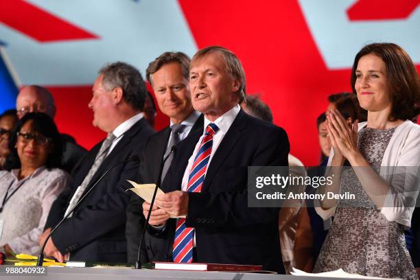 Sir David Amess speaks as the British delegation appear on stage during the Conference In Support Of Freedom and Democracy In Iran on June 30, 2018...