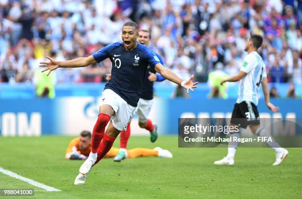 Kylian Mbappe of France celebrates after scoring his team's fourth goal during the 2018 FIFA World Cup Russia Round of 16 match between France and...