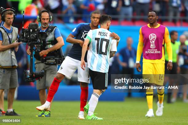 Kylian Mbappe of France embraces Lionel Messi of Argentina at the end of the 2018 FIFA World Cup Russia Round of 16 match between France and...