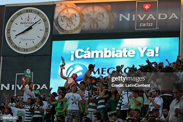 Supporters of Santos Laguna cheer their team during a quarter-final match against Pumas as part of the 2010 Bicentenary Tournament in the Mexican...