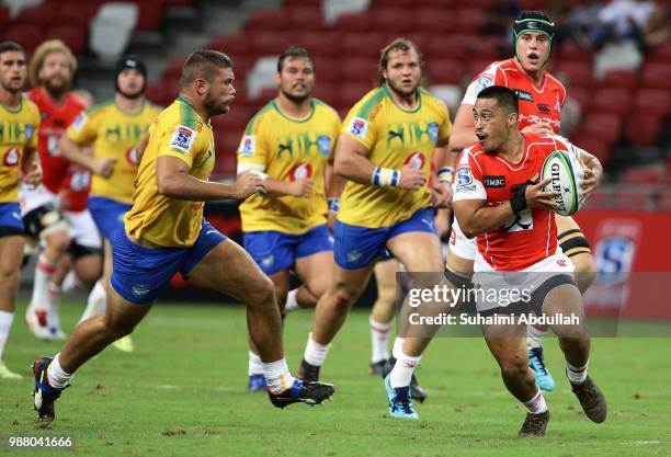 Jason Emery of Sunwolves runs with the ball during the Super Rugby match between Sunwolves and Bulls at the Singapore National Stadium on June 30,...