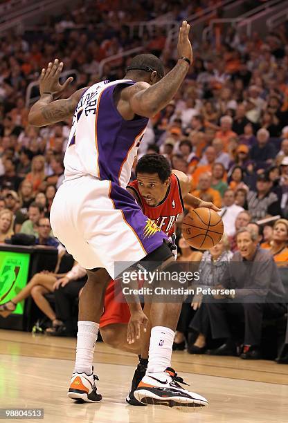 Andre Miller of the Portland Trail Blazers handles the ball against the Phoenix Suns during Game Two of the Western Conference Quarterfinals of the...