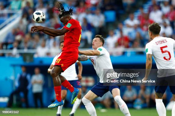 Phil Jones of England competes with Michy Batshuayi of Belgium during the 2018 FIFA World Cup Russia group G match between England and Belgium at...