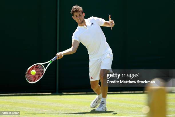 Dominic Thiem of Austria practices on court during training for the Wimbledon Lawn Tennis Championships at the All England Lawn Tennis and Croquet...