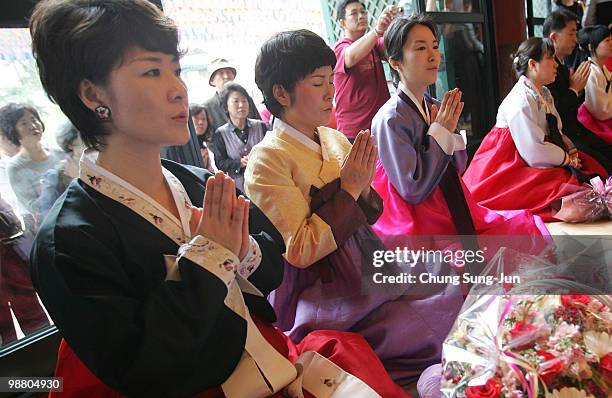 South Korean mothers watch their children during the 'Children Becoming Buddhist Monks' ceremony forthcoming buddha's birthday at a Chogye temple on...