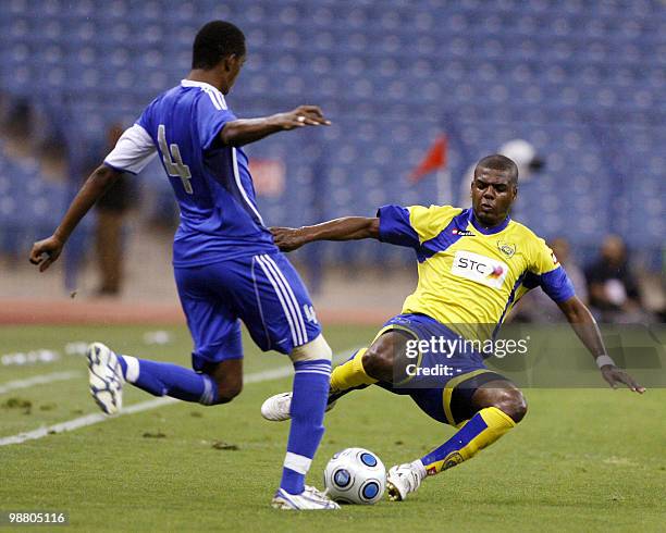 Al-Naser club player Ahmed Dokhi vies with Abdullah al-Zuri of Al-Hilal club during their Saudi King Cup semi-final football match in Riyadh on May...