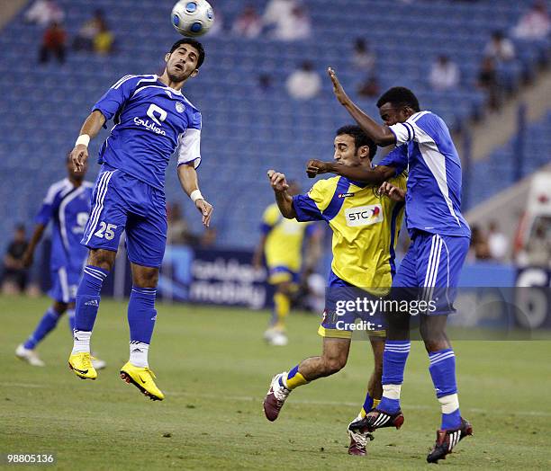 Al-Hilal club player Majed al-Murshidi jumps to head the ball during his team's Saudi King Cup semi-final football match against Al-Naser club in...