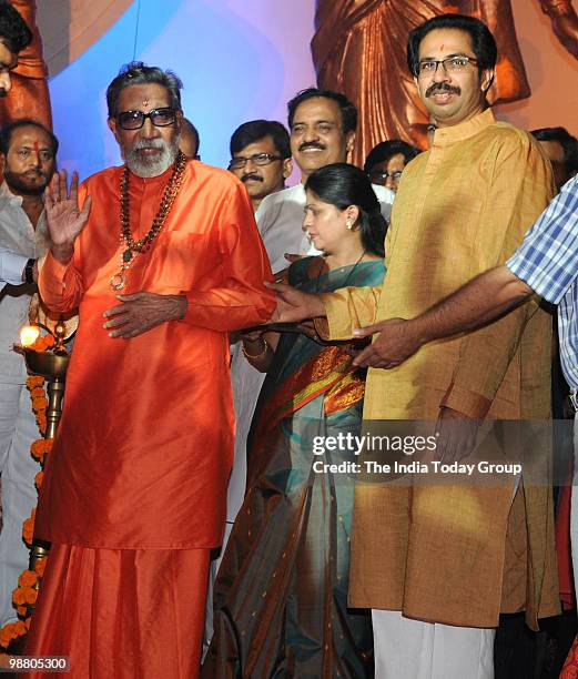 Shiv Sena chief Bal Thackeray with his son and Sena's executive president Uddhav Thackeray interact with media during the inauguration of the...