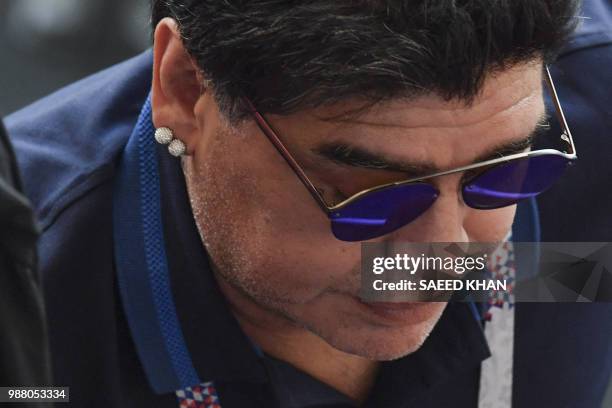 Argentinian former football player Diego Armando Maradona reacts during the Russia 2018 World Cup round of 16 football match between France and...