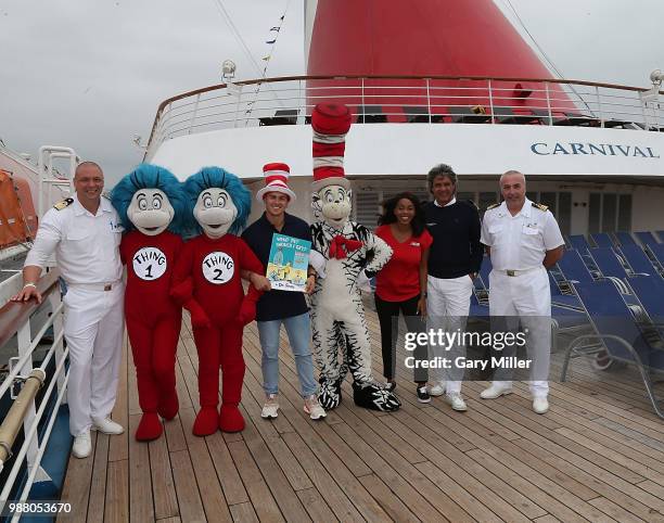 Los Angeles Dodgers player Kike Hernandez poses aboard the Carnival Inspiration before reading Dr. Seuss What Pet Should I Get to children from...