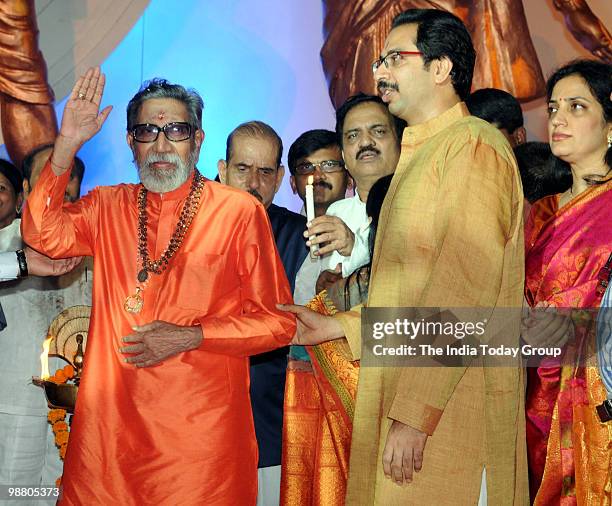 Shiv Sena chief Bal Thackeray with his son and Sena's executive president Uddhav Thackeray interact with media during the inauguration of the...