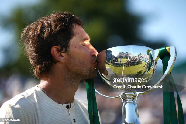 Mischa Zverev of Germany celebrates with the cup after winning his mens singles final against Lukas Lacko of Slovakia during Day Nine of the Nature...