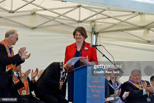 Democratic Unionist Party leader Arlene Foster is applauded as she stands to address an Orange Order rally and march, on June 30, 2018 in...