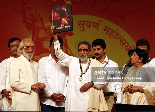 Shiv Sena chief Bal Thackeray launches a photography book by his son Uddhav Thackeray with the historian Babasheb Purandare and Lata Mangeshkar...