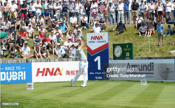 Gregory Havret of France plays his first shot on the 1st tee during Day Three of the HNA Open de France at Le Golf National on June 30, 2018 in...