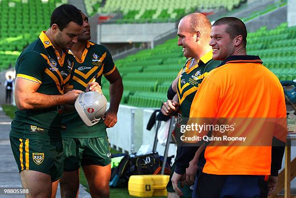 David Shillington of the Kangaroos signs autographs for workers before an Australian ARL Kangaroos team photograph at AAMI Park on May 3, 2010 in...