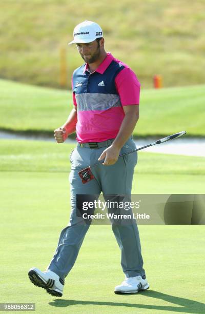 Jon Rahm of Spain celebrates a birdie on the 18th green during the third round of the HNA Open de France at Le Golf National on June 30, 2018 in...