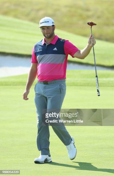 Jon Rahm of Spain celebrates a birdie on the 18th green during the third round of the HNA Open de France at Le Golf National on June 30, 2018 in...