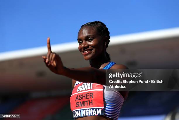 Dina Asher-Smith of Great Britain celebrates winning the Womens 100m Final during Day One of the Muller British Athletics Championships at the...