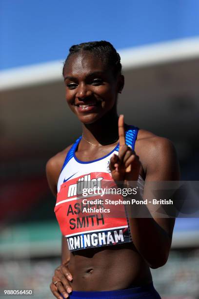 Dina Asher-Smith of Great Britain celebrates winning the Womens 100m Final during Day One of the Muller British Athletics Championships at the...