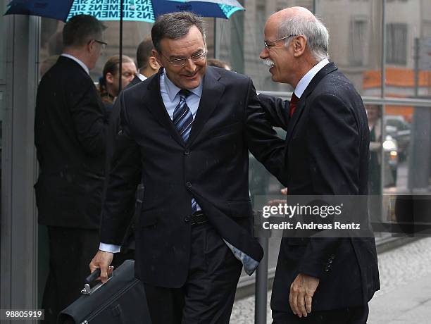 Norbert Reithofer , CEO of Bayerischen Motoren Werke AG and Dieter Zetsche , CEO of Daimler AG arrive for the German summit on electric mobility at...