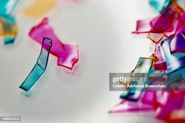 broken colorful pieces on white - broken glass pieces stock pictures, royalty-free photos & images