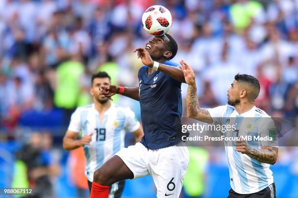 Paul Pogba of France competes with Ever Banega of Argentina during the 2018 FIFA World Cup Russia Round of 16 match between France and Argentina at...