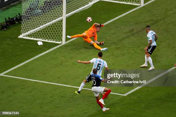 Kylian Mbappe of France scores past Franco Armani of Argentina his team's third goal during the 2018 FIFA World Cup Russia Round of 16 match between...