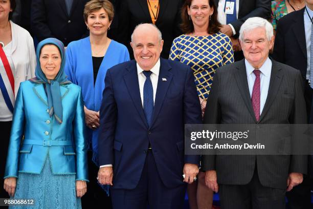 Delegates including Madam Rajavi, President Elect of the Iranian Resistance and former Mayor of New York Rudolph Giuliani and Newt Gingrich pose for...