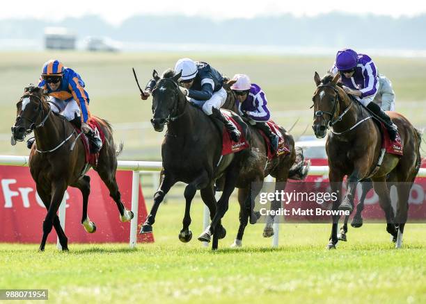 Kildare , Ireland - 30 June 2018; Winner Latrobe, centre, with Donnacha O'Brien up, leads eventual second place finisher Rostropovich, left, with...