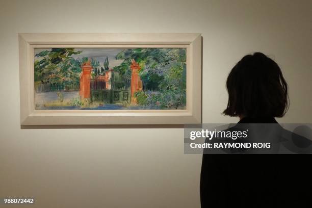 Visitor looks at a painting by Raoul Dufy during the "les ateliers de Perpignan 1940-1950" exhibition at the museum at the Hyacinthe Rigaud museum in...