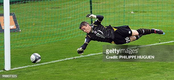 Lille's French goalkeeper Mickael Landreau tries to stop the ball during the French L1 football match Lille vs Nancy on May 02, 2010 at Lille...