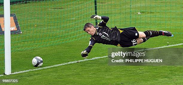 Lille's French goalkeeper Mickael Landreau tries to stop the ball during the French L1 football match Lille vs Nancy on May 02, 2010 at Lille...