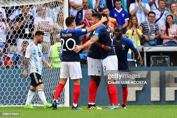 France's players celebrate their win at the end of the Russia 2018 World Cup round of 16 football match between France and Argentina at the Kazan...