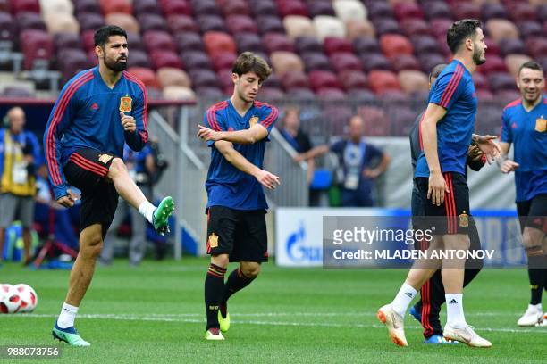 Spain's forward Diego Costa warms up as he takes part in a training session of the Spain's national football team at the Luzhniki Stadium in Moscow,...