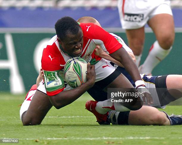 Biarritz' Takudzwa Ngwenya is tackled by Munster's Denis Hurley during the European cup rugby union semi-final match Biarritz vs. Munster on May 2,...