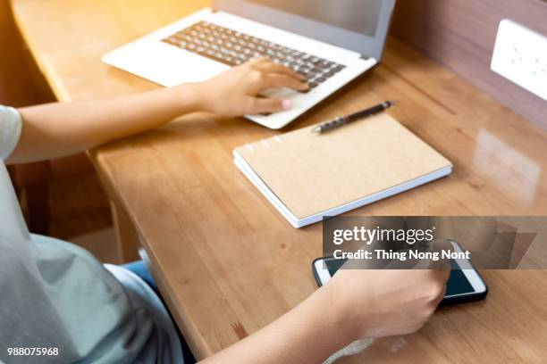 hands of financial manager taking notes when working - ambiance bureau stockfoto's en -beelden