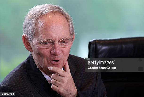 German Finance Minister Wolfgang Schaeuble arrives for a special meeting of the German government cabinet over a bailout package for Greece at the...