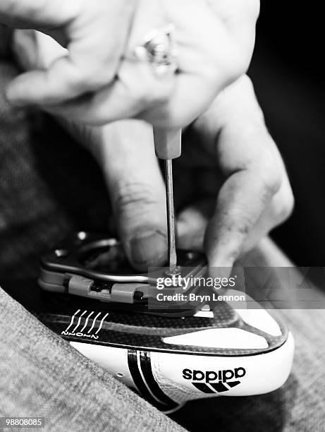 Mechanic adjusts a riders cleats during team GB training for the UCI Track Cycling World Championships at the Ballerup Super Arena on March 24, 2010...