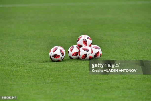 Football balls are picture on the pitch during a training session of the Spain's national football team at the Luzhniki Stadium in Moscow, on June 30...