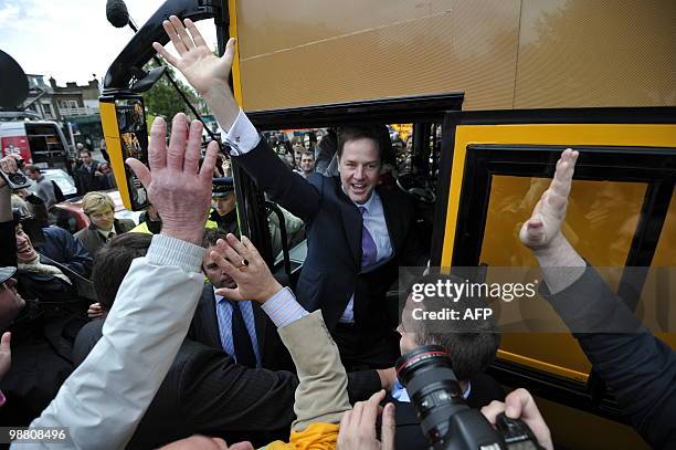 British Liberal Democrat Party leader Nick Clegg waves from his campaign bus as he leaves following a rally in Blackheath, London on May 3, 2010 as...