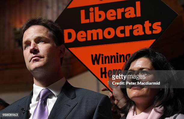 Liberal Democrat leader Nick Clegg stands with his wife Miriam Gonzalez Durantez at the Palace Project community Centre in Streatham watched by on...