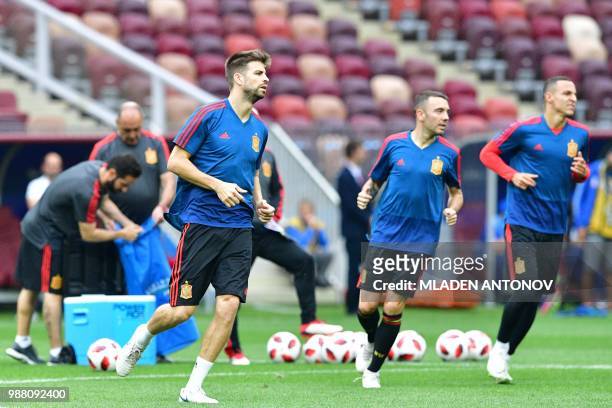 Spain's defender Gerard Pique warms up as he takes part in a training session of the Spain's national football team at the Luzhniki Stadium in...