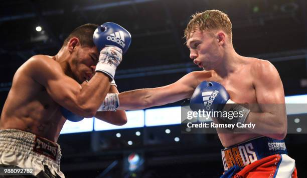 Antrim , United Kingdom - 30 June 2018; Sunny Edwards, right, in action against Christian Narvaez during their super-flyweight bout at the SSE Arena...