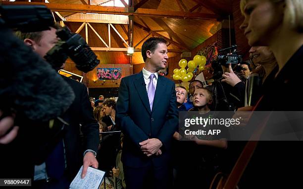 Liberal Democrat leader Nick Clegg is surrounded by the media during a visit to the Palace Project community centre in Streatham, South London on May...