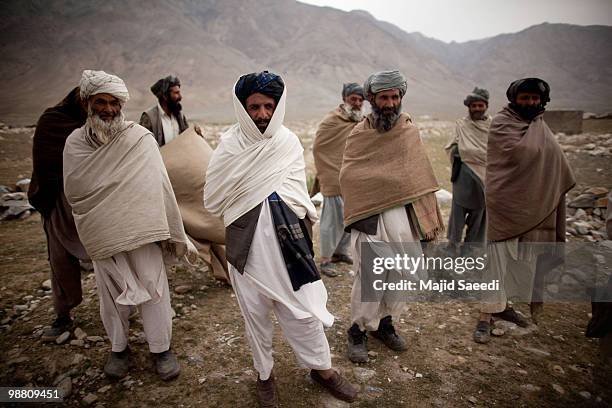 Afghan tribesmen from the Pashtun ethnic minority stand at the location of a future mosque in an area south of Kabul on May 2, 2010 in Afghanistan....