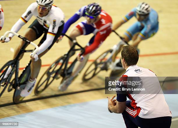 Ed Clancy of Great Britain is spoken to by Rod Ellingworth during the Men's Omnium Scratch race during day five of the UCI Track Cycling World...