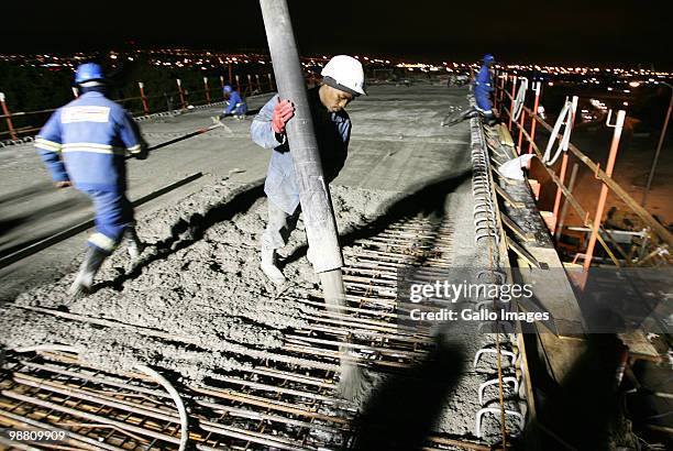 Construction workers work straight through the night to get the roads in Johannesburg, South Africa ready for the Fifa Soccer World Cup 2010, which...