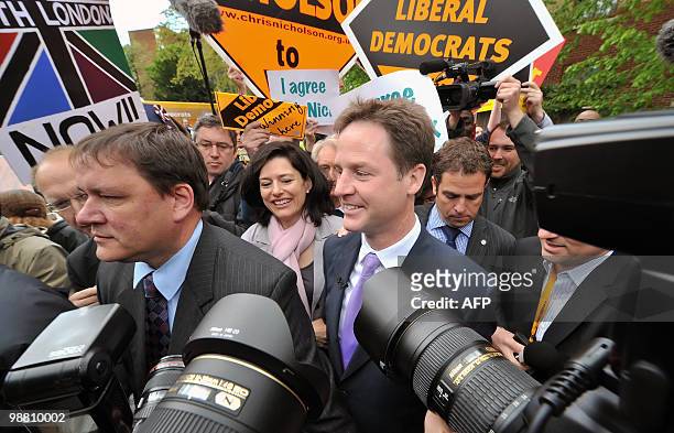 Liberal Democrat leader Nick Clegg walks with his wife Miriam Gonzalez Durantez as he visits the Palace Project community centre in Streatham, South...