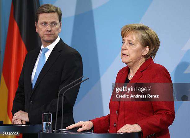 German Chancellor Angela Merkel and Vice Chancellor and Foreign Minister Guido Westerwelle adress a news conference after a special German cabinet...